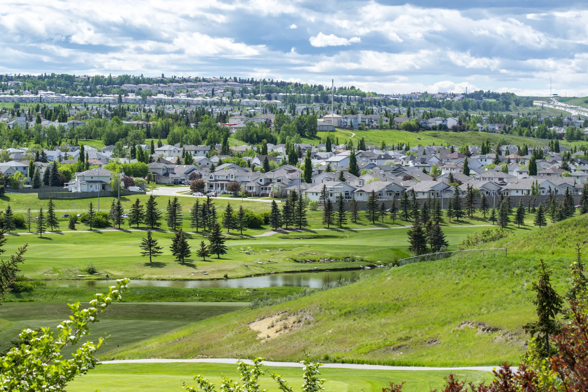 Photograph of Panorama Hills rolling terrain and established neighbourhood panorama